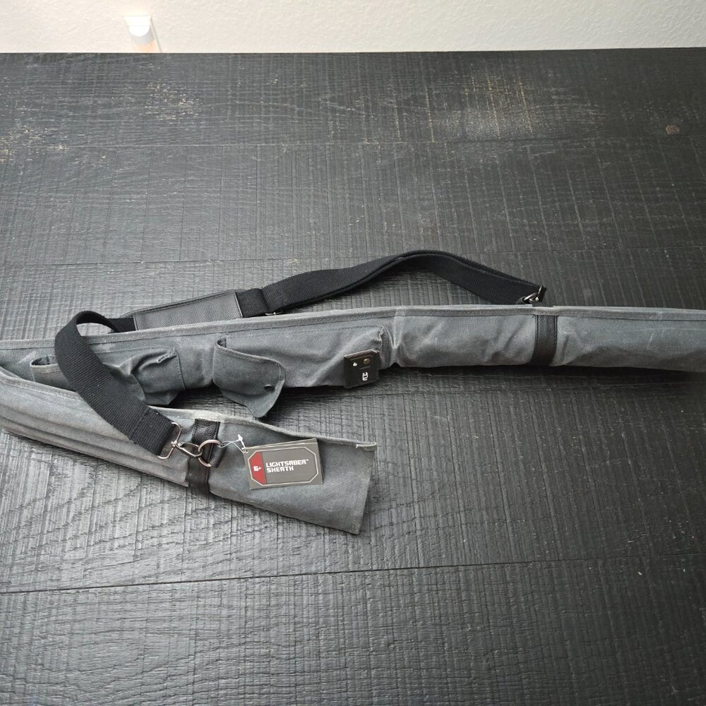New, never used. Disney's Star Wars, Galaxy's Edge Lightsaber Carrying Sheath.
